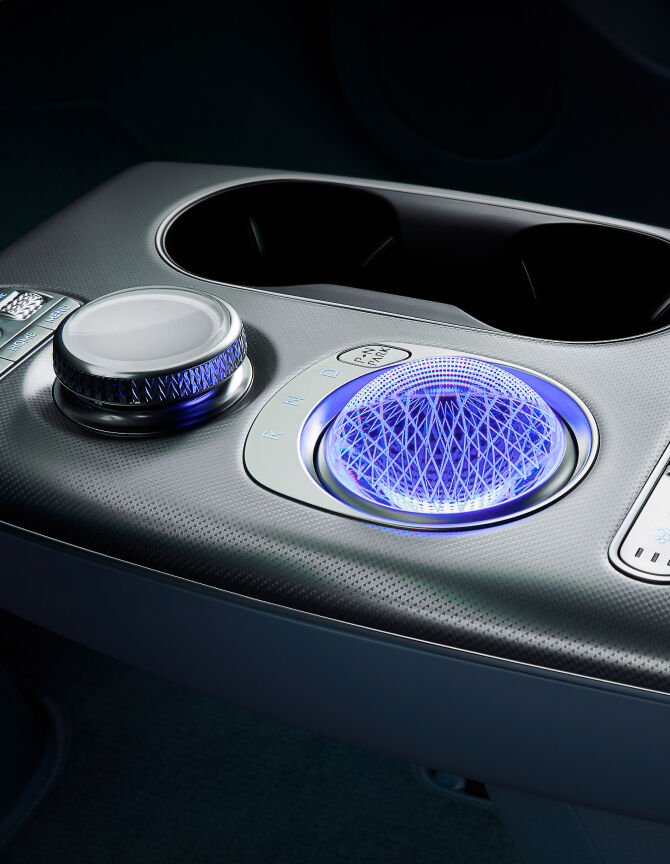 The GV60's electronic shift dial, which is subtly lit in crystal form, appears enlarged.
